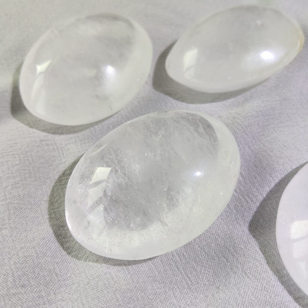 Close-up of polished clear quartz palm stones